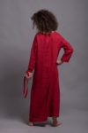 Back view of the linen kaftan maxi dress in red, designed with drop shoulder long sleeves