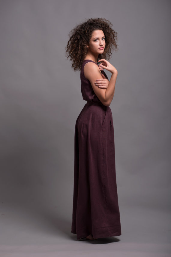 Side profile of natural linen palazzo pants, highlighting wide leg and pockets