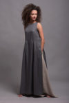 Model wearing a natural flax linen skirt and long tunic, highlighting its breathable and medium-weight fabric.
