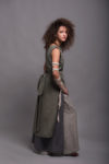 Model wearing the LINAS dress layered over linen pants for a relaxed, artistic look.