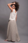 Side angle of the high-waisted linen skirt, showcasing its elegant A-line silhouette.