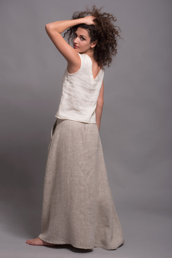 Side angle of the high-waisted linen skirt, showcasing its elegant A-line silhouette.