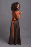 Side view of the slim-fit linen wrap top with short sleeves