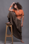 Front view of the wrap linen crop top paired with a flowing skirt.