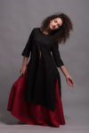 Red boho-inspired linen skirt with a wide, flowing design and three tiers