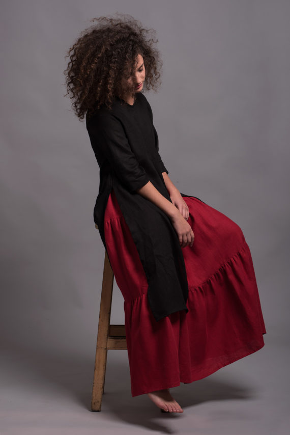 Three-tiered bohemian-style maxi skirt with a loose fit and elastic waistband for comfort.
