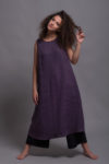 Sleeveless linen dress featuring a round neckline, wide shoulder straps, and side pockets