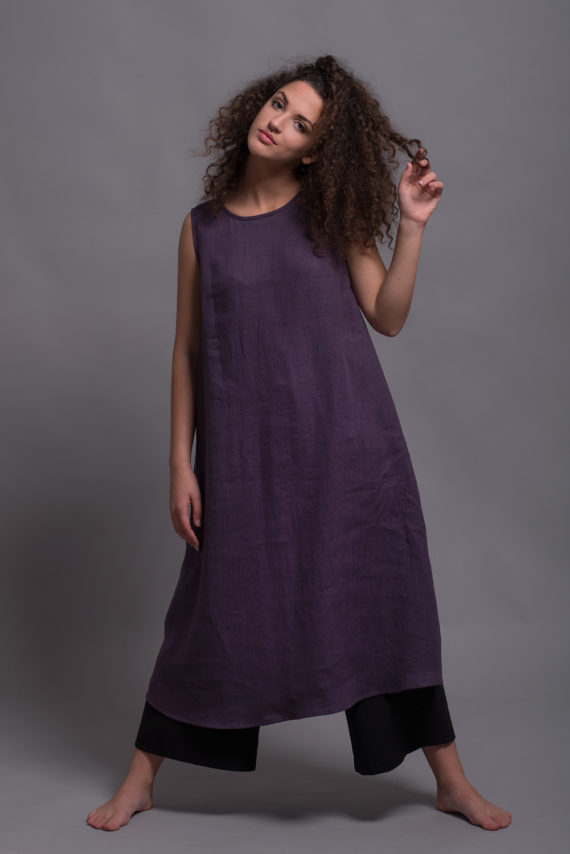 Sleeveless linen dress featuring a round neckline, wide shoulder straps, and side pockets