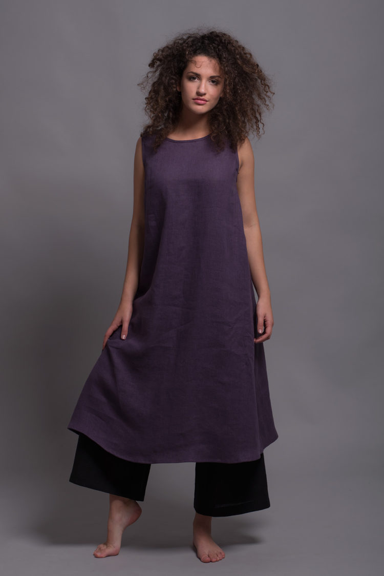 Model wearing the Loose Linen Dress UNA in Royal Purple with a relaxed A-line fit and sleeveless design
