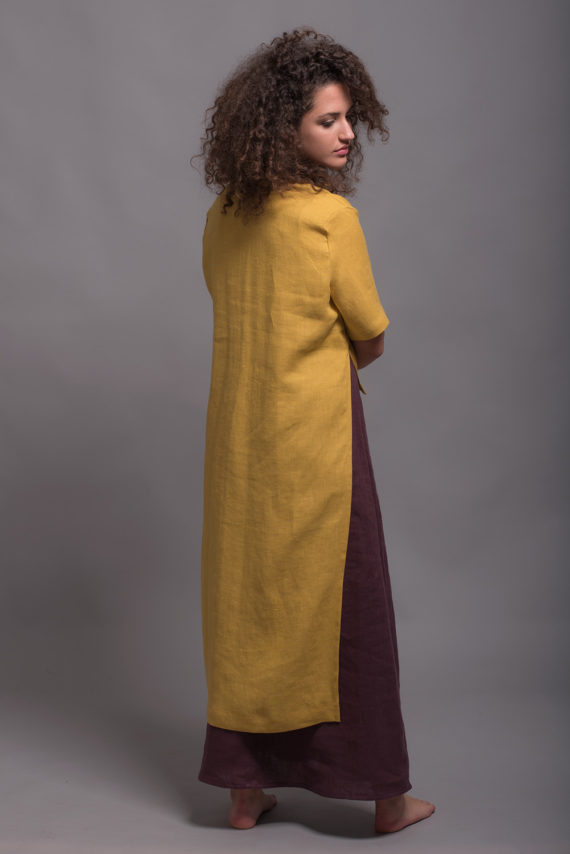 Back view of the long hem, showing the flowing silhouette of the medium-weight linen fabric.