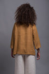 Back view of the linen blouse SOVA, showing the smooth, breathable linen fabric.