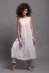Model wearing a sleeveless linen underdress with a straight hemline and mid-ankle length
