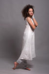 Side angle of the lightweight linen underdress with wide shoulder straps and a round neckline