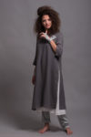 High front slit shown in detail, enhancing the tunic’s ease of movement.