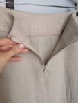 Close-up of the Natural flax linen skirt with a back zipper, offering a tailored and comfortable fit.
