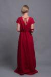 Back view of the open-back linen maxi dress with a delicate tie tape closure.