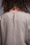 Close-up of the round neckline and medium-weight linen fabric of the NIKA dress.
