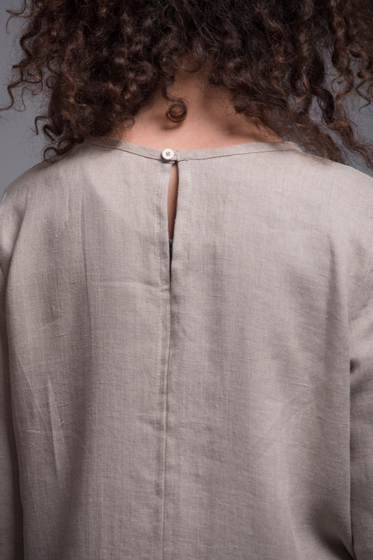 Close-up of the round neckline and medium-weight linen fabric of the NIKA dress.