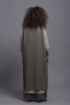 Back angle of the LINAS pinafore linen dress, emphasizing the flow and structure of the A-line design.