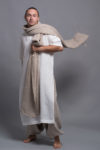 Extra-long linen shawl elegantly wrapped around the , paired with linen kaftan for men