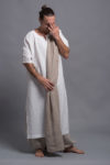Front view of white long linen tunic for men with a slit neckline