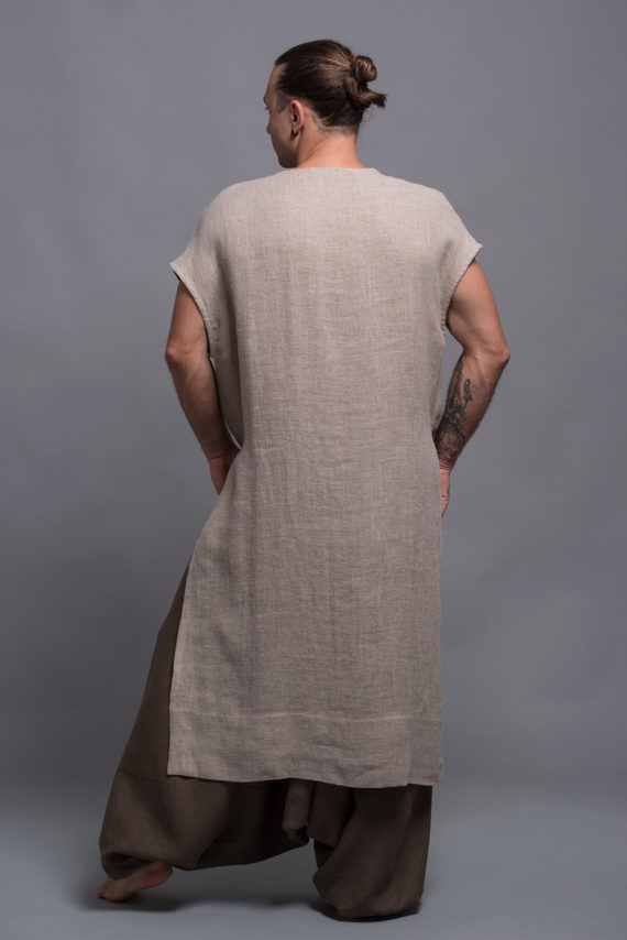 Back view of sleeveless linen tunic in natural flax coarse fabric