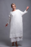 Front view of the Women's White Linen Tunic SANGA, showcasing the round neckline and relaxed fit.