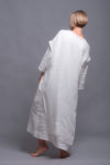 Model wearing the Women's White Linen Tunic SANGA layered over white linen dress.