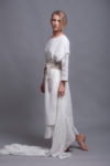Model showcasing the tunic's versatility in movement, styled casually with accessories.