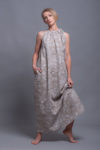Model walking in the Printed Linen Dress TAYA, showing its lightweight and breathable fabric.