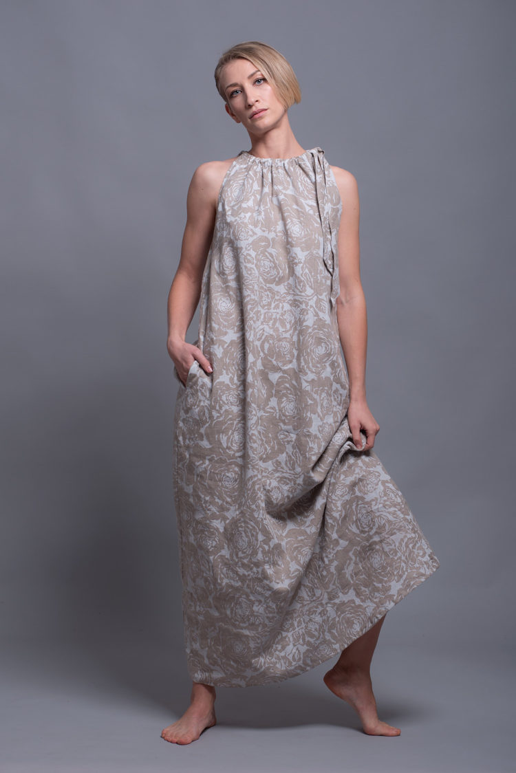 Model walking in the Printed Linen Dress TAYA, showing its lightweight and breathable fabric.