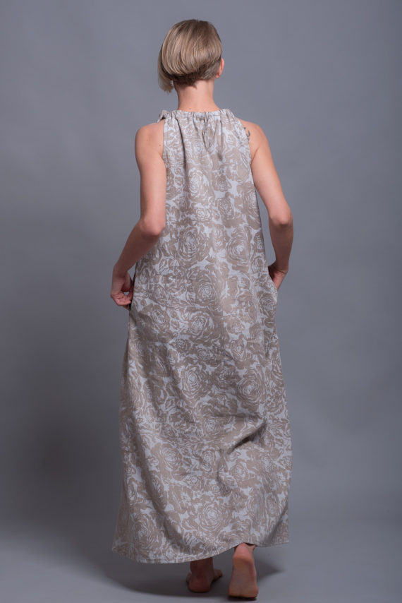 Back view of the linen dress, displaying the open-back design with an adjustable tie.