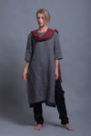 Model wearing the MIRA tunic in Shark Skin Gray, styled with black linen pants for a minimalist look.
