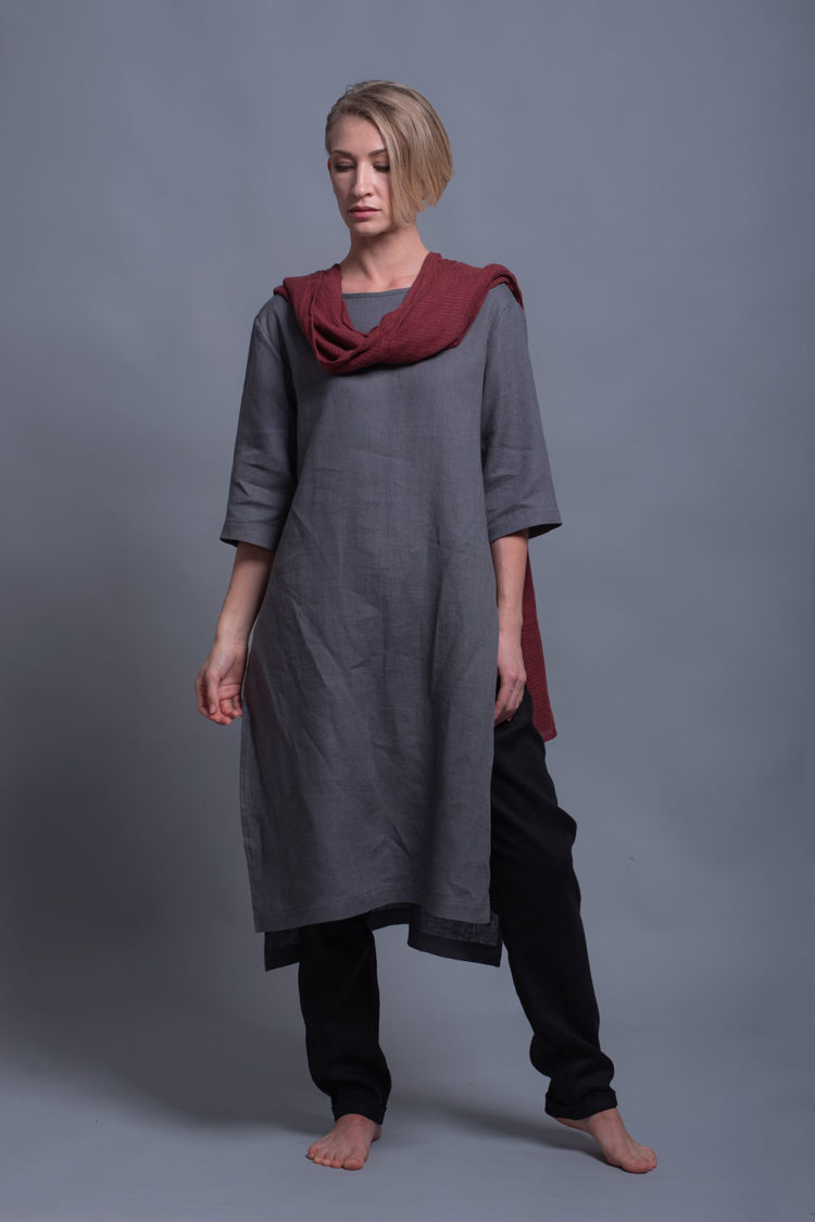 Model wearing the MIRA tunic in Shark Skin Gray, styled with black linen pants for a minimalist look.