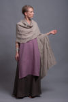 Natural linen shawl wrap draped over shoulders