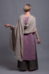 Folded natural linen shawl showcasing its lightweight drape