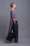Model styling the BORA Linen Pants in Charcoal Gray, showing the wide-leg fit and minimalist design