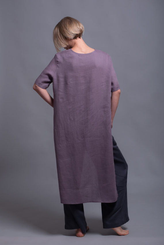 Back view of the long back hem, showing the flowing silhouette of the lightweight linen fabric.