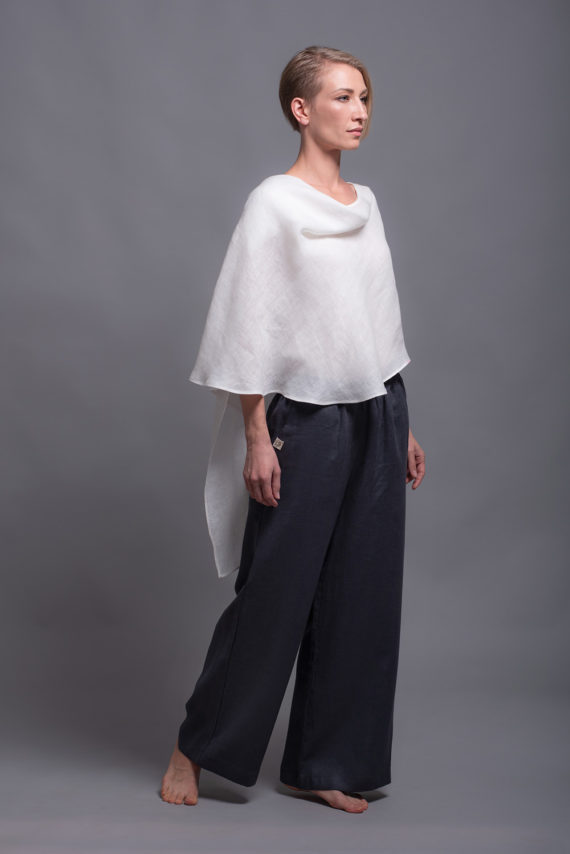Front view of the round neckline and layered construction of the white linen top.