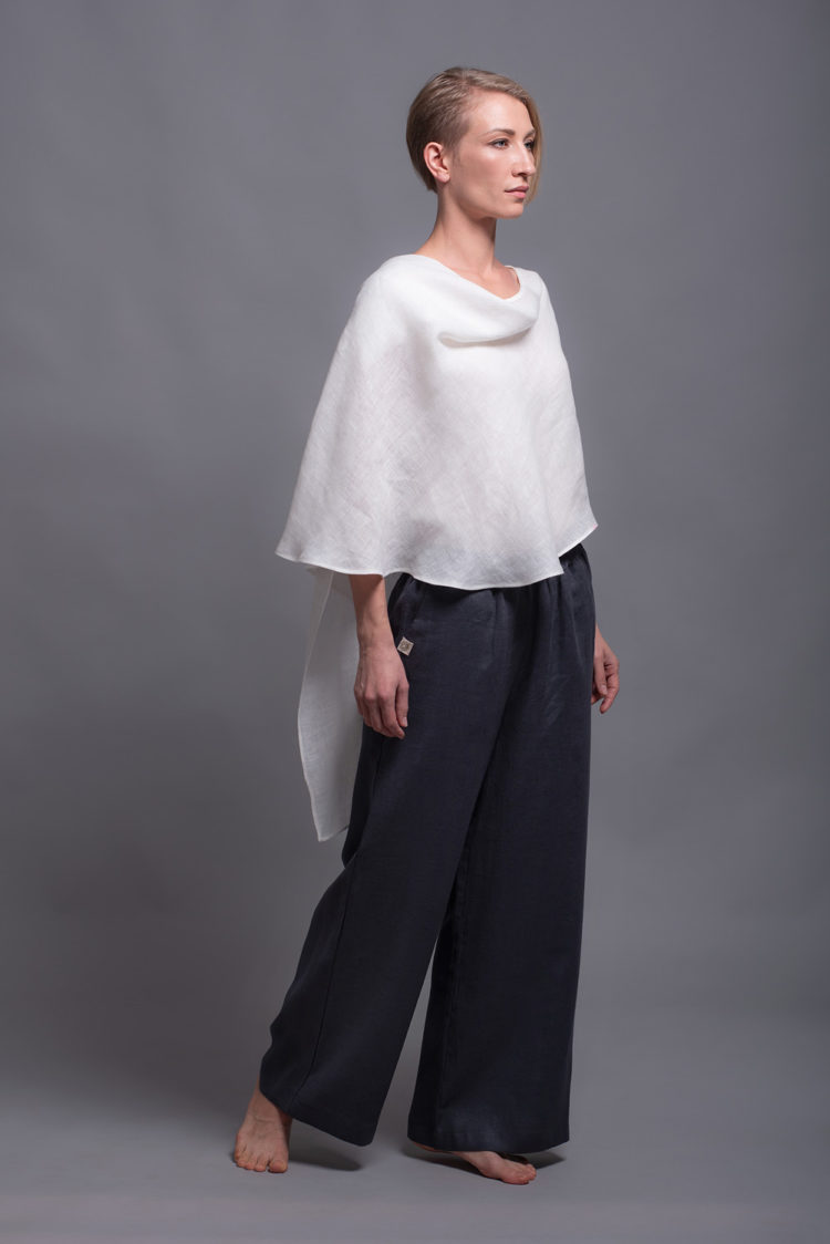 Front view of the round neckline and layered construction of the white linen top.