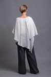 Back view of the double-layer white linen top with a relaxed, breezy fit.