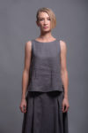 Close-up of the boat neckline and sleeveless cut of the linen tank top MAHA.