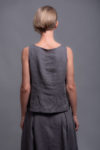 Back view of the summer linen tank top MAHA, emphasizing its lightweight design and clean lines.