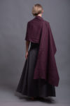 Extra-wide linen shawl elegantly wrapped around the neck