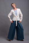 Flowing wide-leg linen pants in movement, showing relaxed fit