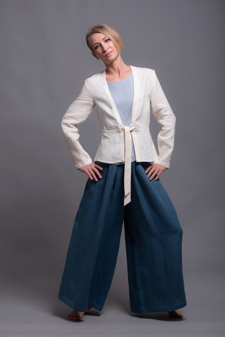 Flowing wide-leg linen pants in movement, showing relaxed fit