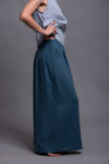 Detailed view of pocket on natural linen palazzo pants