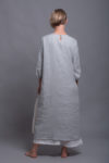 Back view of the silver gray NIKA dress, highlighting its straight hemline and three-quarter length sleeves.