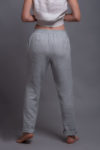 Back view of linen tapered pants featuring an elasticated waistband for comfort