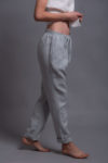 Elastic waist linen trousers with a custom-length option for a tailored fit.